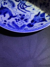 Six Chinese celadon and blue and white 'crabs and fish' cups and saucers, Kangxi