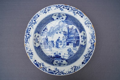 A pair of Chinese blue and white basins with figures in a garden, Yongzheng