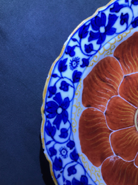 Four Chinese blue, white and iron red 'lotus' plates, Qianlong/Jiaqing
