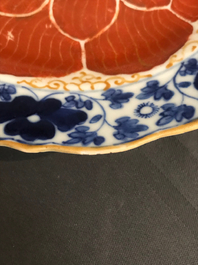 Four Chinese blue, white and iron red 'lotus' plates, Qianlong/Jiaqing