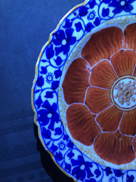 Four Chinese blue, white and iron red 'lotus' plates, Qianlong/Jiaqing