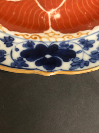 Four Chinese blue, white and iron red 'lotus' plates, Qianlong/Jiaqing