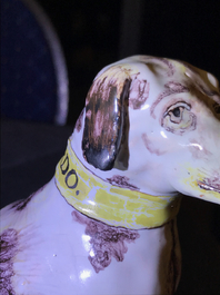 A manganese and yellow Brussels faience model of a dog, 18th C.