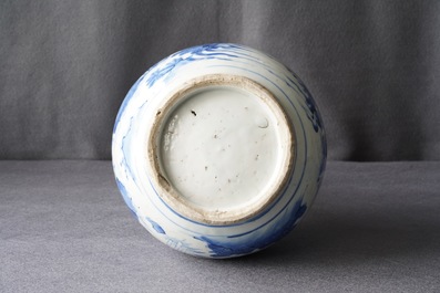 A Chinese blue and white bottle vase with figures in a landscape, Transitional period