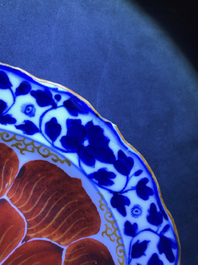 Four Chinese blue, white and iron red 'lotus' plates, Qianlong/Jiaqing