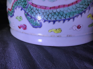 A Chinese blue and white fish bowl and a famille rose 'dragon' jardini&egrave;re, 19th C. and Yongzheng
