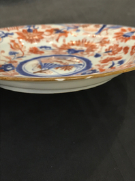 Four Chinese Imari-style plates with raised central roundels, Kangxi