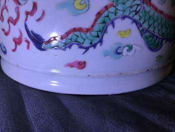 A Chinese blue and white fish bowl and a famille rose 'dragon' jardini&egrave;re, 19th C. and Yongzheng