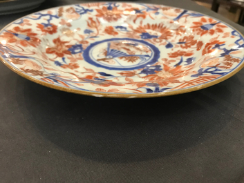 Four Chinese Imari-style plates with raised central roundels, Kangxi