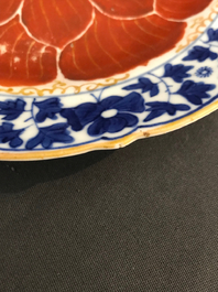 Four Chinese blue, white and iron red 'lotus' plates, Qianlong/Jiaqing
