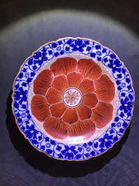 Four Chinese blue, white and iron red 'lotus' plates, Qianlong/Jiaqing