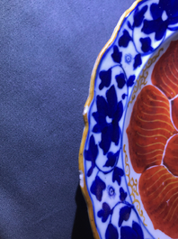 Four Chinese blue, white and iron red 'lotus' plates, Qianlong/Jiaqing