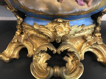 A pair of massive gilt bronze-mounted S&egrave;vres porcelain ewers and a jardini&egrave;re, France, 19th C.