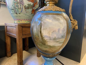 A pair of massive gilt bronze-mounted S&egrave;vres porcelain ewers and a jardini&egrave;re, France, 19th C.