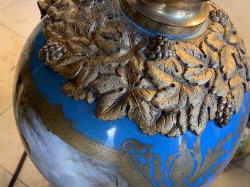 A pair of massive gilt bronze-mounted S&egrave;vres porcelain ewers and a jardini&egrave;re, France, 19th C.