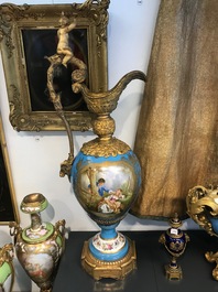 A pair of massive gilt bronze-mounted S&egrave;vres porcelain ewers and a jardini&egrave;re, France, 19th C.