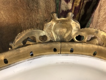 A pair of massive gilt bronze-mounted S&egrave;vres porcelain ewers and a jardini&egrave;re, France, 19th C.