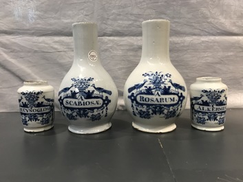 Four Dutch Delft blue and white pharmacy bottles and two jars, 18th C.
