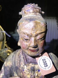 Une grande figure d'un gardien en bronze et polychromie, Chine, Ming