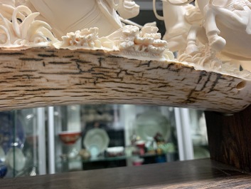 A Chinese carved ivory group with warriors on horseback, 2nd quarter 20th C.