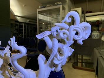 A large Chinese ivory group of an elephant with two ladies, 1st half 20th C.