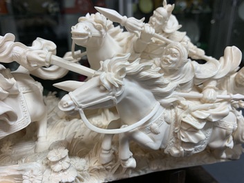 A Chinese carved ivory group with warriors on horseback, 2nd quarter 20th C.