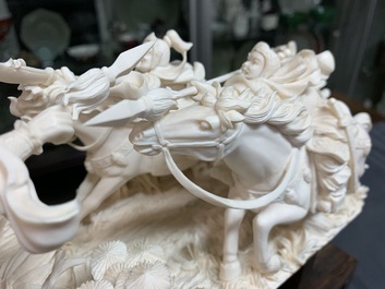 A Chinese carved ivory group with warriors on horseback, 2nd quarter 20th C.