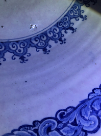 A fine and large Dutch Delft blue and white 'maritime subject' bowl depicting Atlas, 18th C.