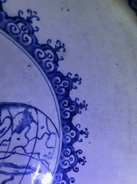 A fine and large Dutch Delft blue and white 'maritime subject' bowl depicting Atlas, 18th C.