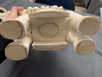 A large Chinese ivory group of an elephant with two ladies, 1st half 20th C.