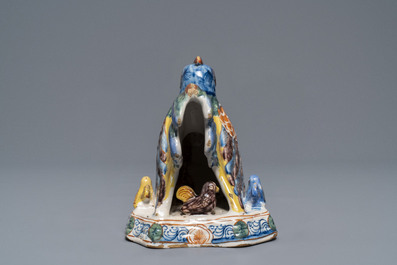 A polychrome Dutch Delft group of a hen with chickens, 18th C.