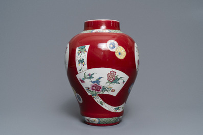 A fine Chinese famille rose ruby ground baluster vase with floral panels, Yongzheng