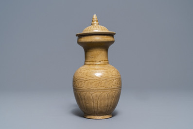 A Chinese brown-glazed vase and cover with incised design, Song