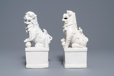 A pair of large Chinese Dehua blanc de Chine buddhist lion joss stick holders, Kangxi