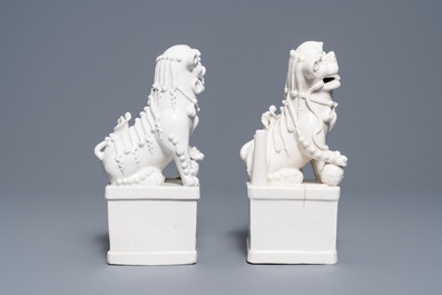 A pair of large Chinese Dehua blanc de Chine buddhist lion joss stick holders, Kangxi