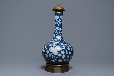 A Chinese blue-ground slip-decorated bottle vase with ormolu mounts, 19th C.