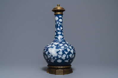 A Chinese blue-ground slip-decorated bottle vase with ormolu mounts, 19th C.