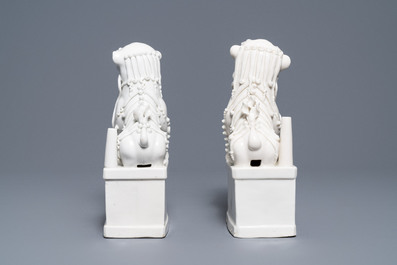 A pair of large Chinese Dehua blanc de Chine buddhist lion joss stick holders, Kangxi
