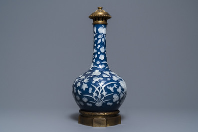 A Chinese blue-ground slip-decorated bottle vase with ormolu mounts, 19th C.