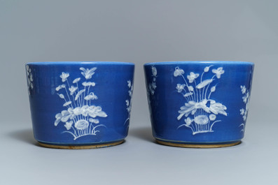 A pair of Chinese blue-ground slip-decorated jardini&egrave;res, 19th C.