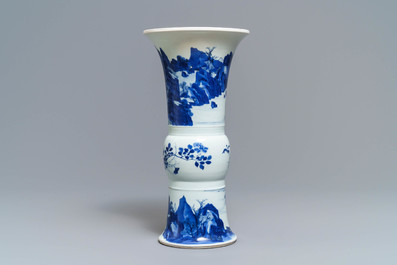 Een Chinese blauw-witte gu vaas met landschapsdecor, Kangxi merk en periode