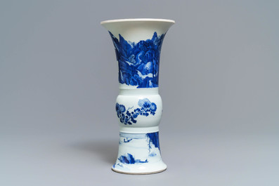 Een Chinese blauw-witte gu vaas met landschapsdecor, Kangxi merk en periode