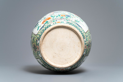 A Chinese famille verte fish bowl with birds among flowers, 19th C.