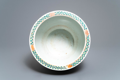 A Chinese famille verte fish bowl with birds among flowers, 19th C.