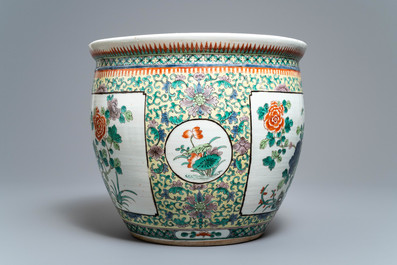 A Chinese famille verte fish bowl with birds among flowers, 19th C.