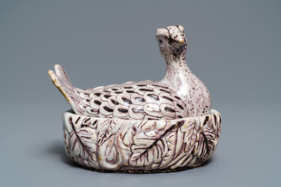 A Dutch Delft manganese 'plover' butter tub and cover, 18th C.