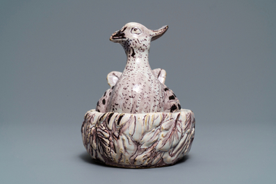 A Dutch Delft manganese 'plover' butter tub and cover, 18th C.