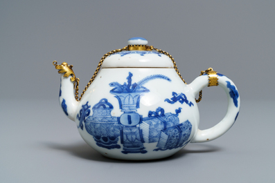 A Chinese blue and white gilt brass-mounted teapot, Jiajing mark, Kangxi
