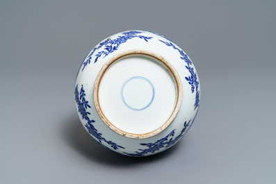 A Chinese blue and white bottle vase with dancers on a floral ground, 19th C.