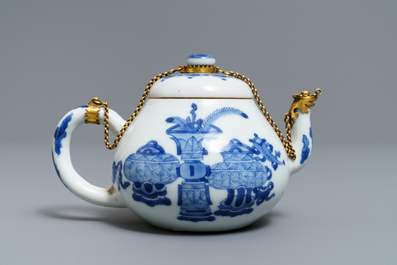 A Chinese blue and white gilt brass-mounted teapot, Jiajing mark, Kangxi
